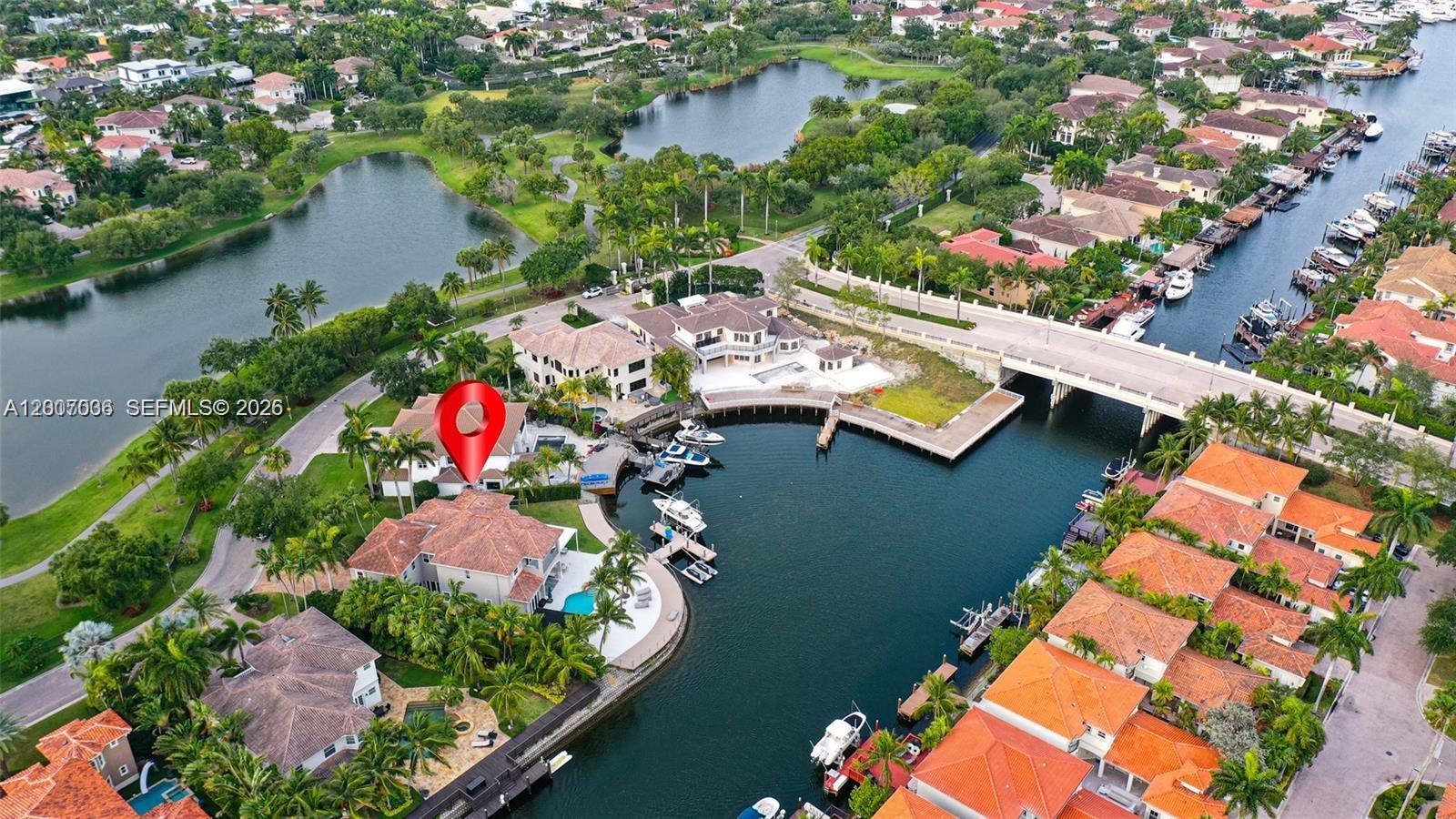 An aerial view shows a waterfront house with a pool and boat dock — 1260 Harbor Ct, Hollywood FL 33019, HOLLYWOOD, FL