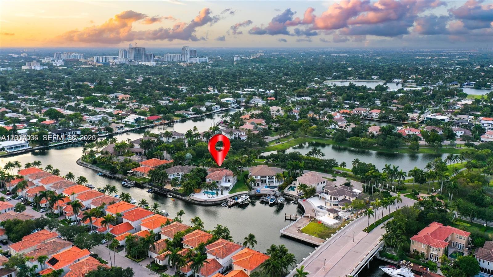 An aerial view shows a waterfront house with a pool and boat dock — 1260 Harbor Ct, Hollywood FL 33019, HOLLYWOOD, FL