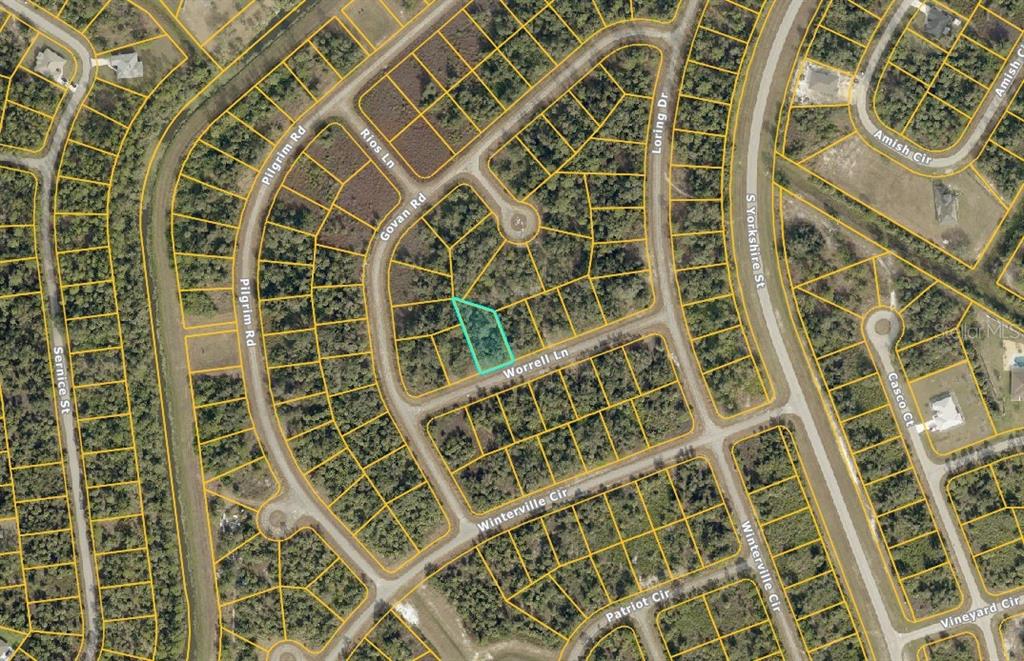 This is an aerial map showing a vacant lot highlighted in a residential neighborhood — Lot #15 WORRELL LANE, NORTH PORT, FL