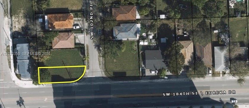 This aerial map shows a vacant corner lot highlighted in yellow along a main road — 184 ST SW 102 PL, Miami FL 33157, MIAMI, FL
