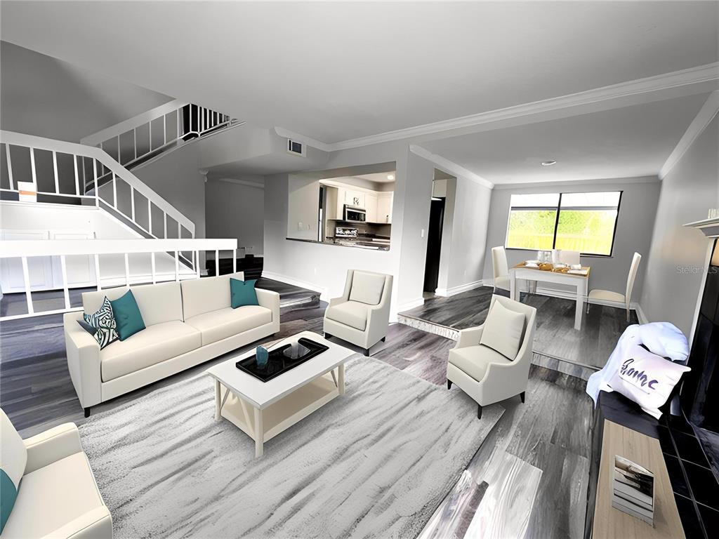 A living room and dining area with gray wood-look flooring, white furniture, and a staircase — 1040 WAVERLY DRIVE, LONGWOOD, FL