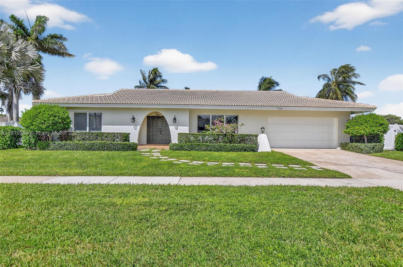 A single-story house with a white exterior, a tiled roof, and a paved driveway — 5660 Golfway Dr # 0, Boca Raton FL 33433, BOCA RATON, FL