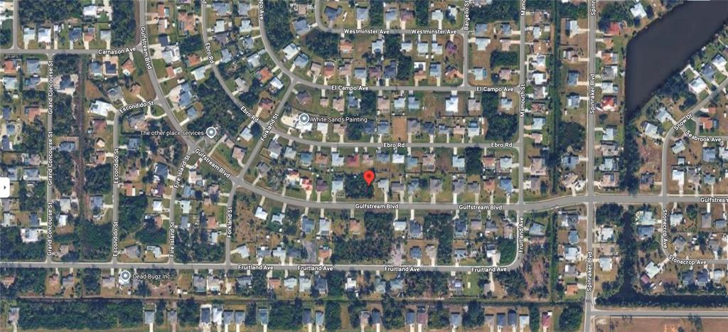 This is an aerial map view of a residential neighborhood with a red location pin — 9894 GULFSTREAM BOULEVARD, ENGLEWOOD, FL