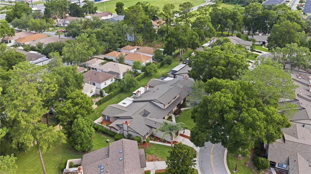 An aerial view shows a suburban neighborhood with multiple houses, mature trees, and paved streets — 3824 NE 19TH STREET CIRCLE, OCALA, FL