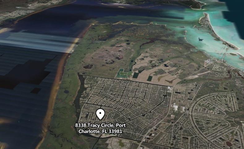 An aerial map view showing a residential neighborhood in Port Charlotte, Florida — 8338 TRACY CIRCLE, PORT CHARLOTTE, FL