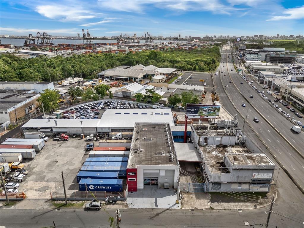 An aerial view shows a commercial warehouse facility with shipping containers and a parking lot — 168-198 CALLE MONTERREY, SAN JUAN, PR