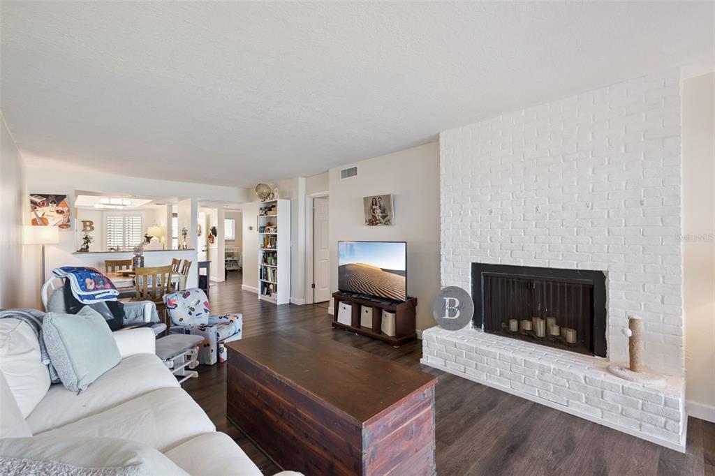 A covered entryway features a dark door with a peace sign wreath and a welcome sign — 4109 FAIRVIEW VISTA POINT UNIT 114, ORLANDO, FL