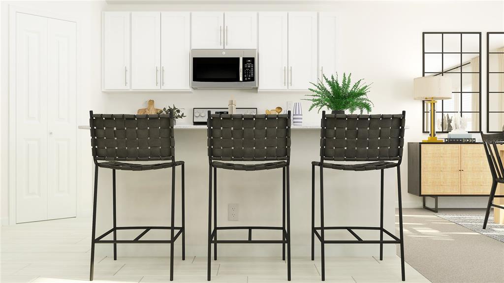 This is a digital rendering of a kitchen featuring white cabinets and three woven barstools — 6030 BLUE PALOMA COURT, PALMETTO, FL