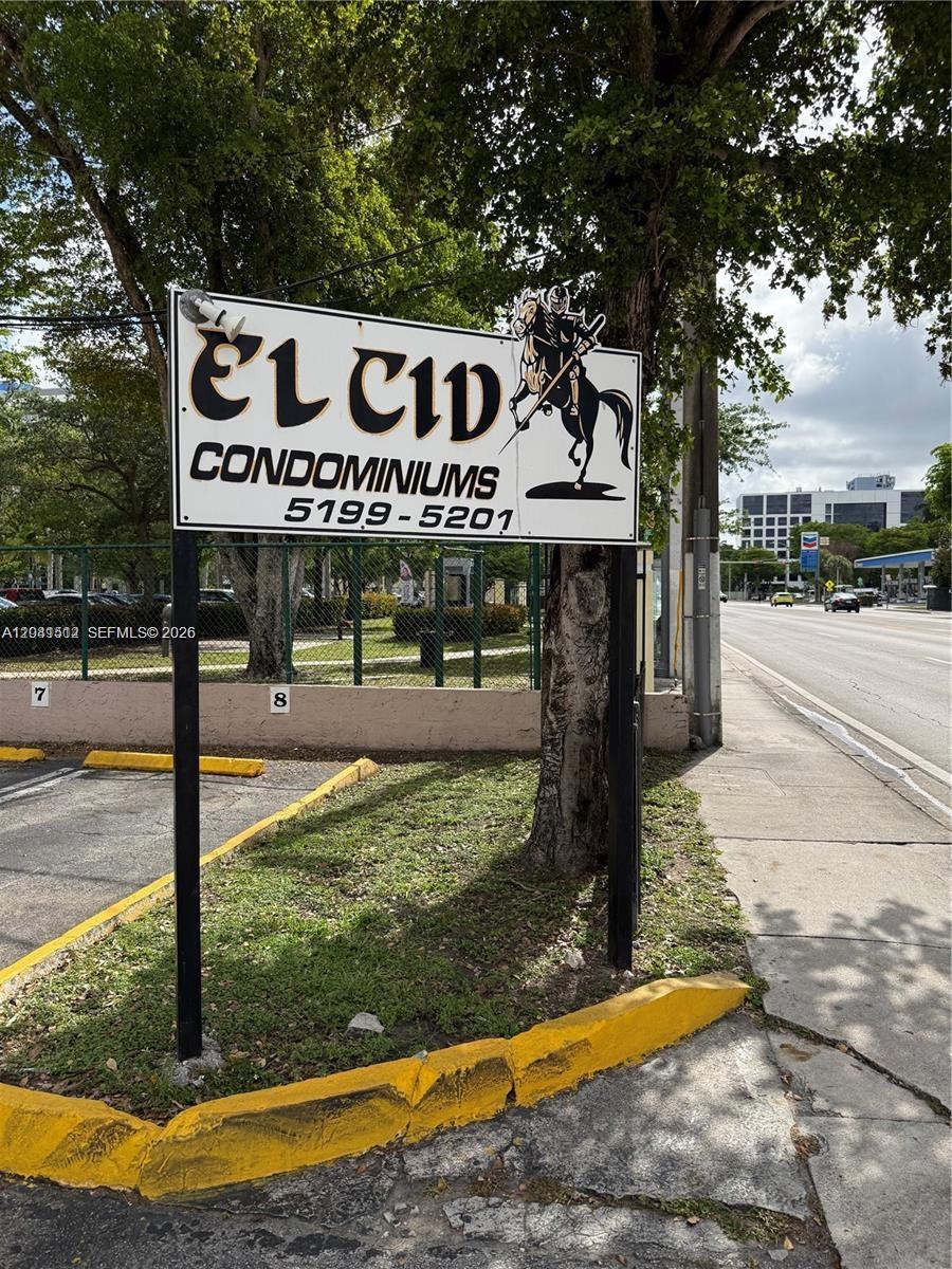 A sign for El Cid Condominiums stands near a parking lot and a public road — 5199 NW 7th St # 111, Miami FL 33126, MIAMI, FL