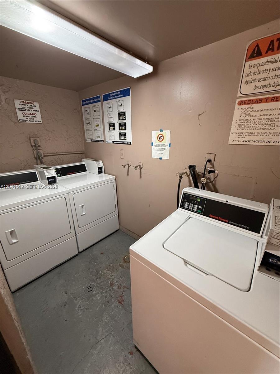A laundry room features two white dryers and one Speed Queen washing machine — 5199 NW 7th St # 111, Miami FL 33126, MIAMI, FL