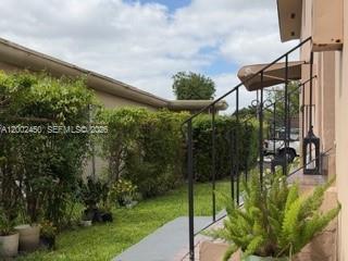A kitchen with white cabinets, stainless steel appliances, and light-colored tile flooring — 50 W 11th St # 1, Hialeah FL 33010, HIALEAH, FL