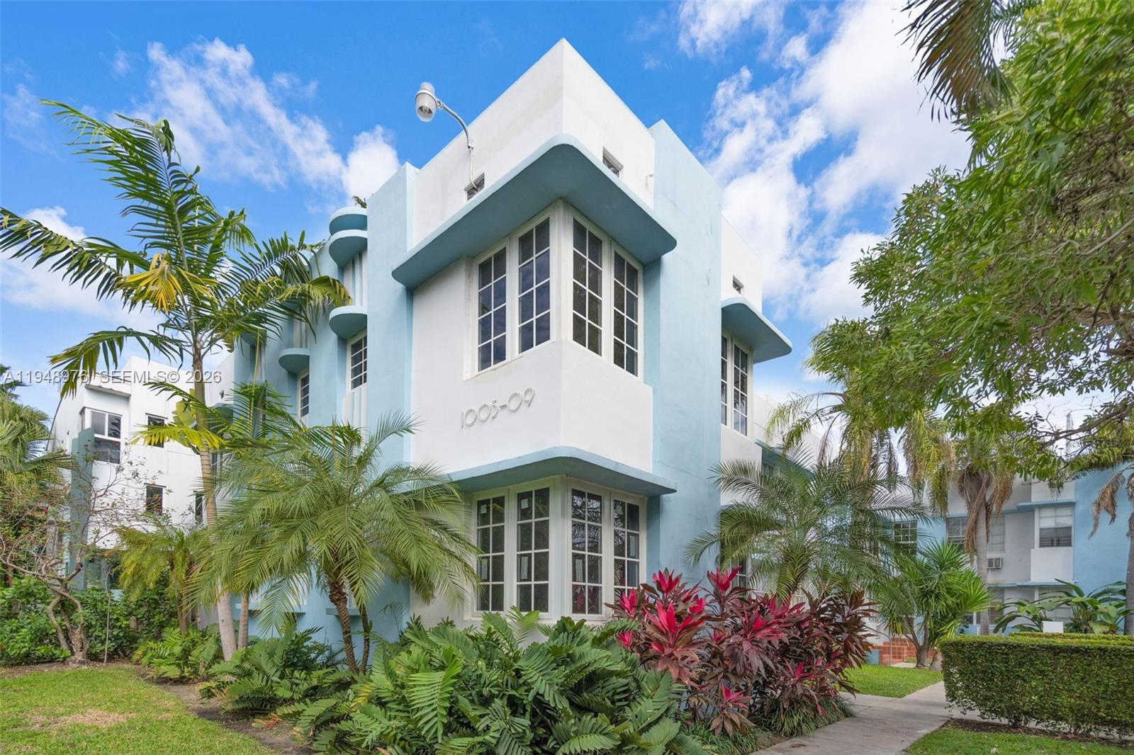 A two-story Art Deco building features light blue and white stucco walls with corner windows — 1009 Meridian Ave # 15, Miami Beach FL 33139, MIAMI BEACH, FL