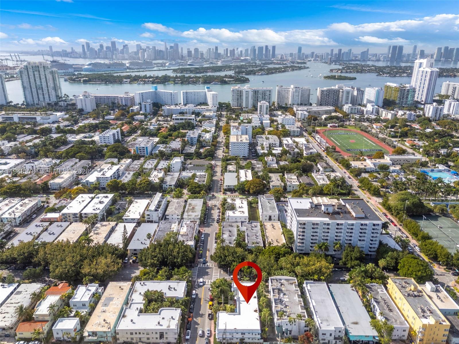 An aerial view shows a city neighborhood with a red location pin marking a building — 1009 Meridian Ave # 15, Miami Beach FL 33139, MIAMI BEACH, FL