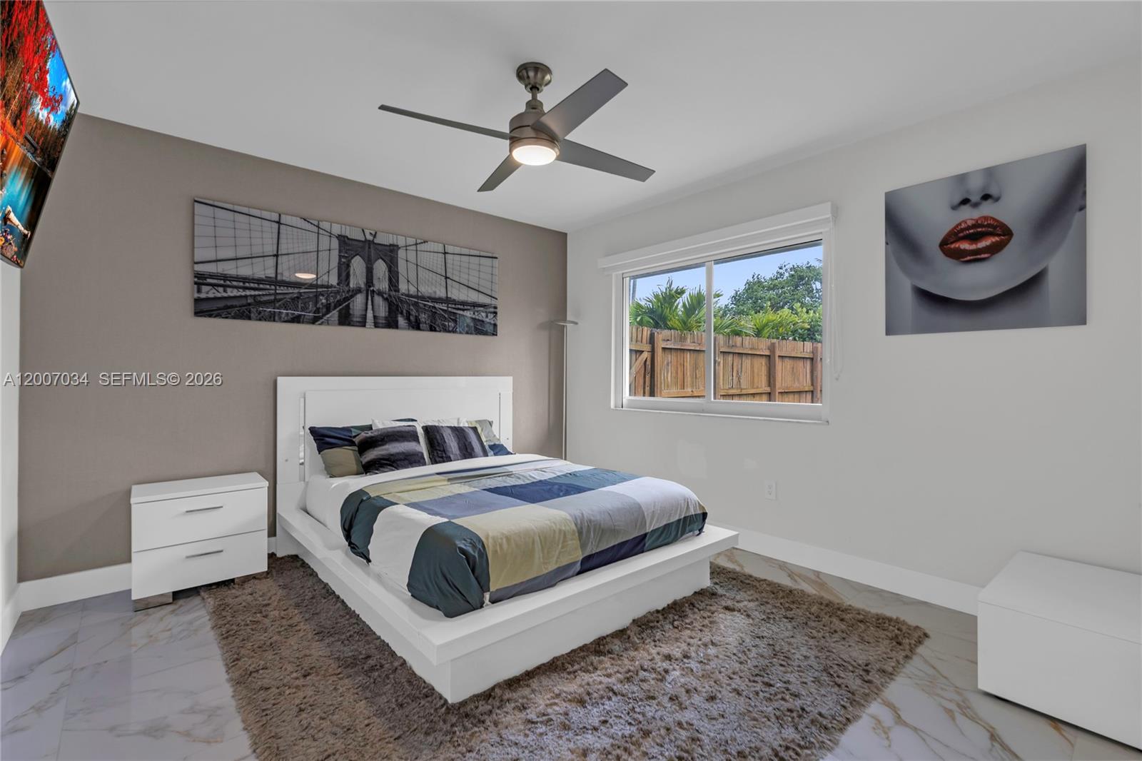 A modern bedroom features a platform bed, a ceiling fan, and a large window — 13540 SW 98th Ct, Miami FL 33176, MIAMI, FL
