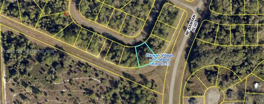 This is an aerial map view of a vacant residential lot in a wooded subdivision — 406 Skipper Ter, La Belle FL 33935, LA BELLE, FL