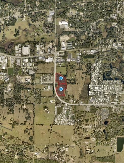 This is an aerial map view showing a highlighted parcel of land — 2810 SOUTH STREET, LEESBURG, FL