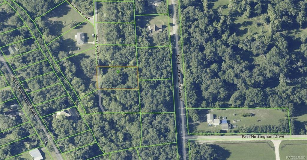 This is an aerial map view of a wooded residential lot outlined in orange — 384 N STAFF POINT, INVERNESS, FL