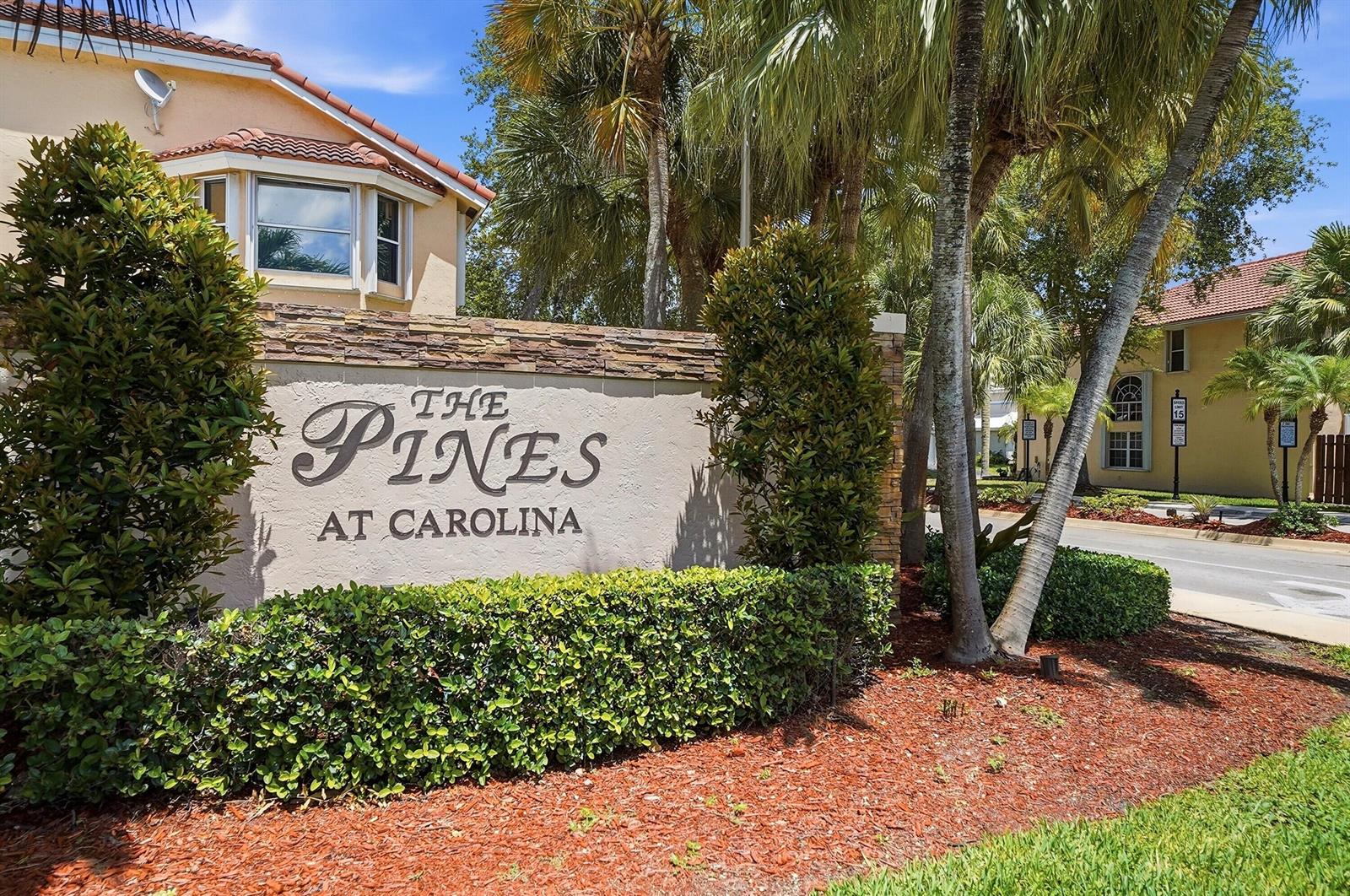 A stone-accented monument sign for The Pines at Carolina stands before palm trees and buildings — 6851 NW 27th Street, Margate FL 33063, MARGATE, FL