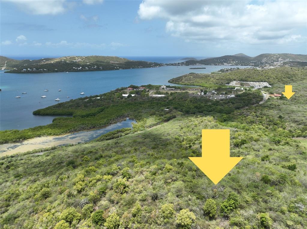 An aerial view shows a large, undeveloped hillside lot overlooking a coastal bay — 250 km. BARRIO FRAILE, CULEBRA, PR
