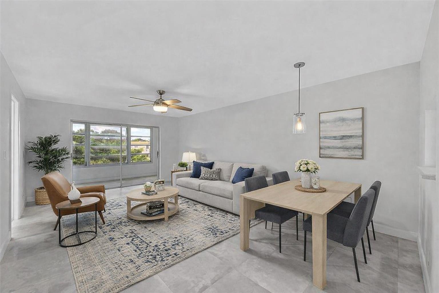 A living and dining area features light gray tile floors, a neutral sofa, and furniture — 9761 Sunrise Lakes Boulevard # 301, Sunrise FL 33322, SUNRISE, FL