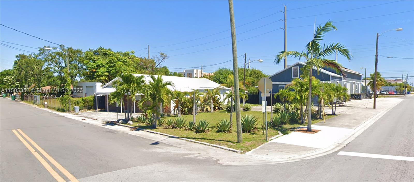 A street-level view shows a white single-story building and a blue structure with palm trees — 400 1st St, Dania Beach FL 33004, DANIA BEACH, FL