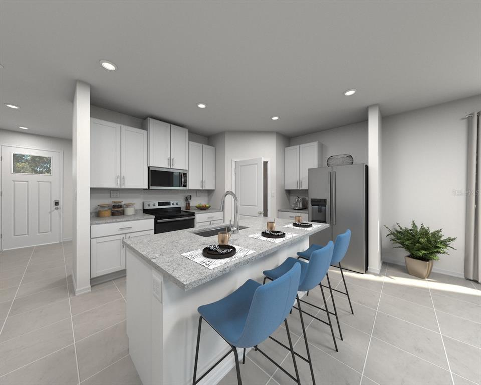 This is a rendering of a modern kitchen featuring white cabinets, an island, and appliances — 12614 HOURGLASS WAY, DADE CITY, FL
