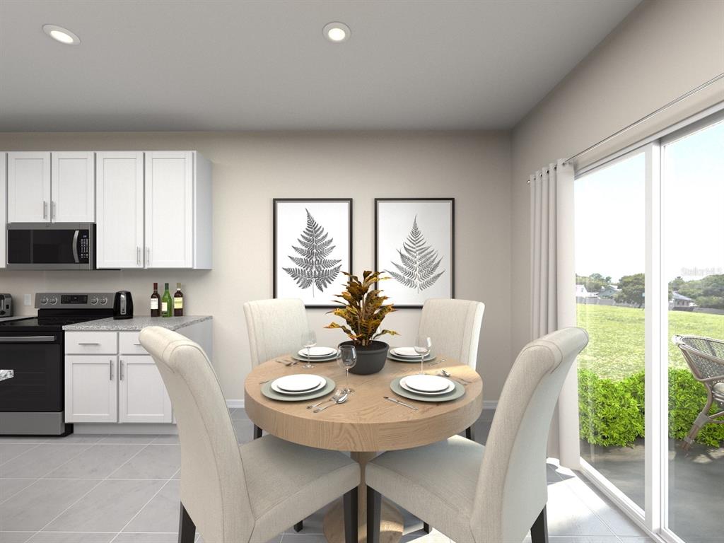 This is a digital rendering of a dining area with a round table and chairs — 12 GARNI DRIVE, PALM COAST, FL