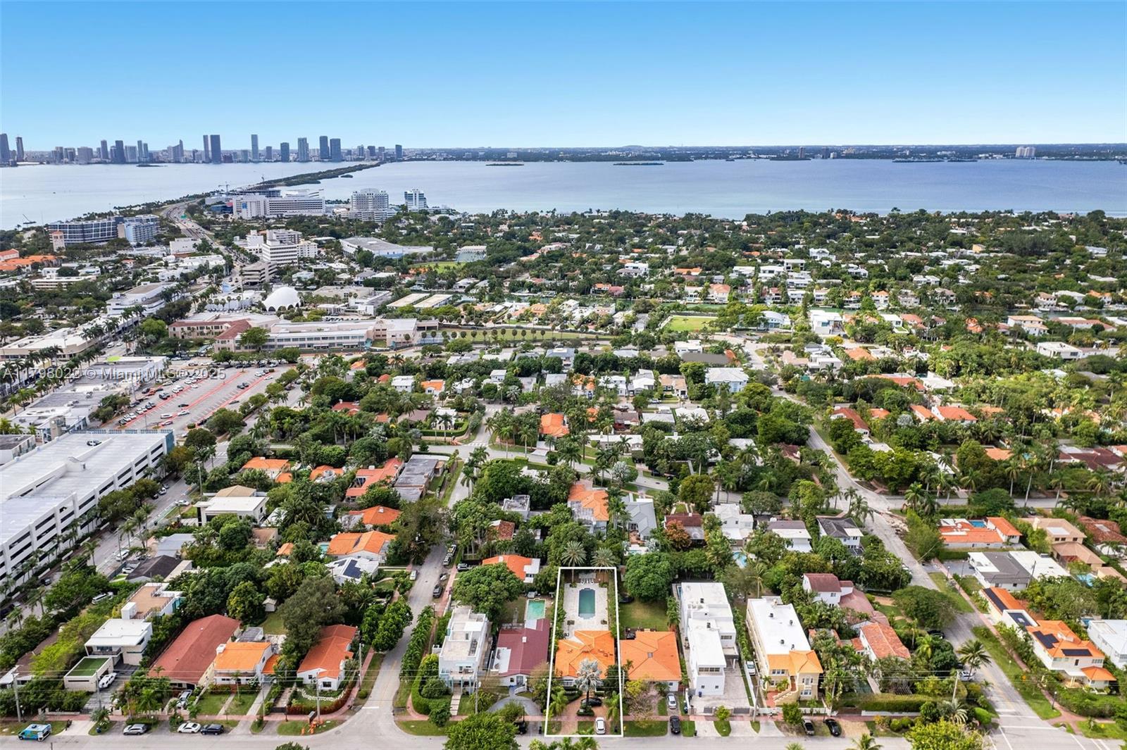 An aerial view shows a residential property with a swimming pool and orange-tiled roof — 4316 Sheridan Ave, Miami Beach FL 33140, MIAMI BEACH, FL