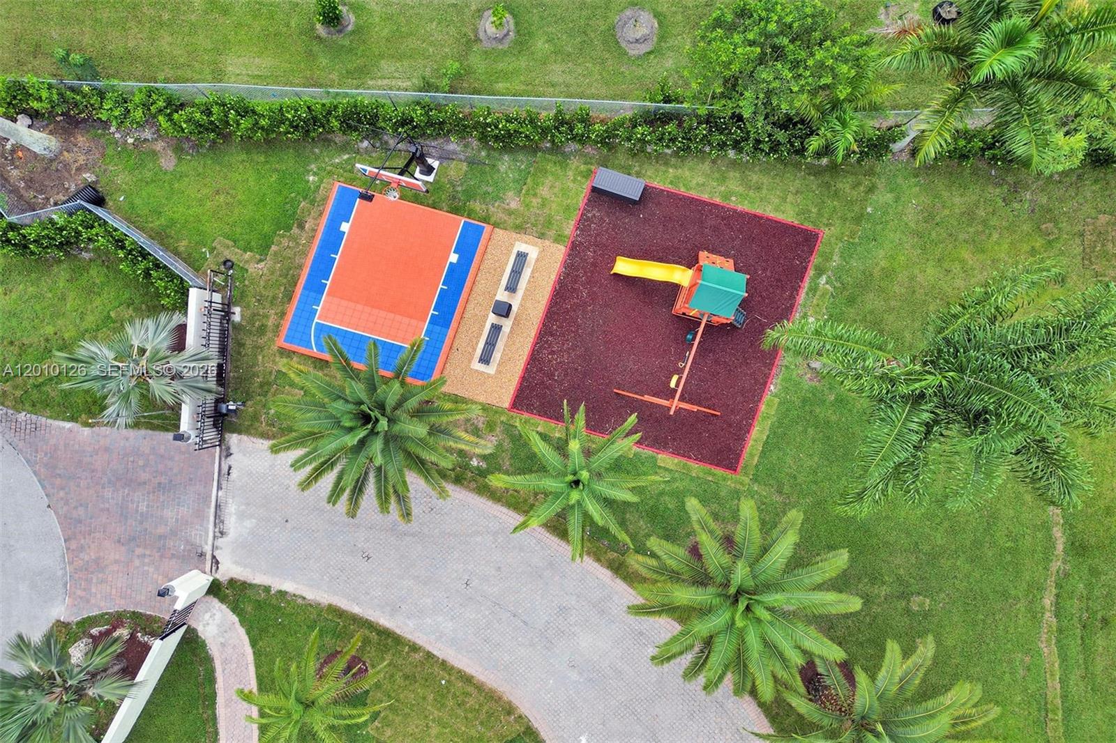 An aerial view shows a basketball court and a playground area with a swing set — 16301 SW 62nd St, Southwest Ranches FL 33331, SOUTHWEST RANCHES, FL
