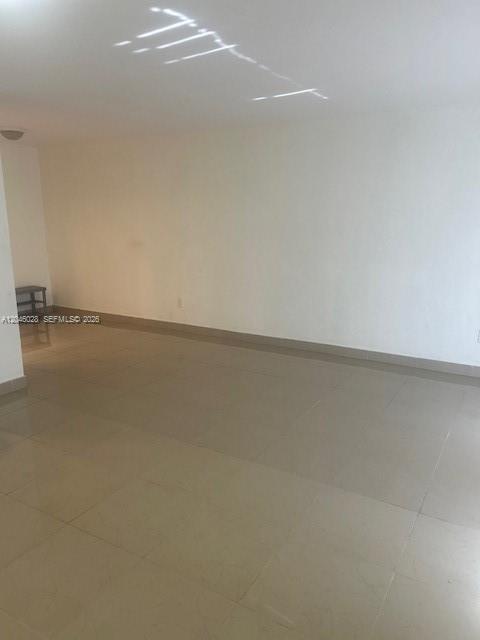 An empty room with white walls and light-colored tile flooring — 10395 N Kendall Dr # V4, Miami FL 33176, MIAMI, FL