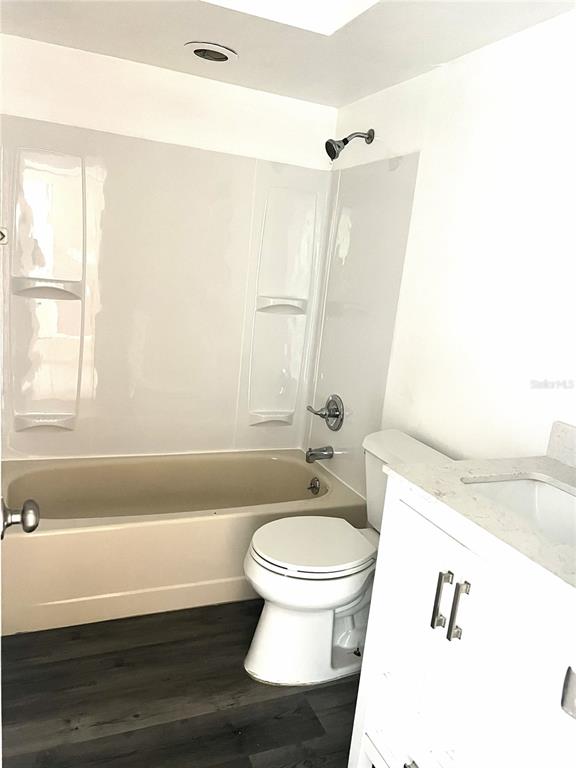 A bathroom features a beige bathtub, a white toilet, and a white vanity cabinet — 4440 S LAKE ORLANDO PARKWAY UNIT 6-4, ORLANDO, FL