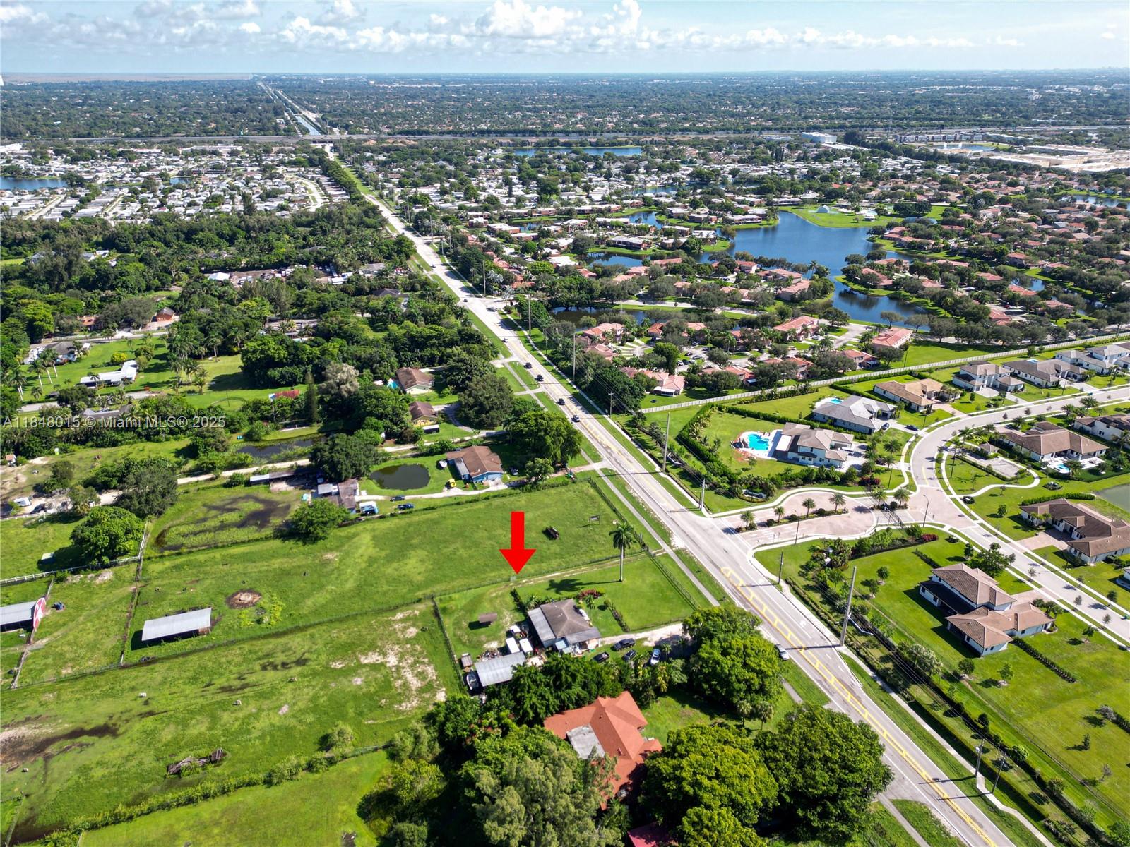 An aerial view shows a house on a large grassy lot near a road — 1921 SW 112th Ave, Davie FL 33325, DAVIE, FL