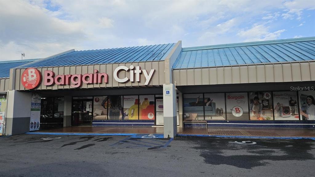 The exterior of a commercial building features a blue metal roof and Bargain City signage — 100 PR-100 KM 7.2 INT. PR-102, CABO ROJO, PR
