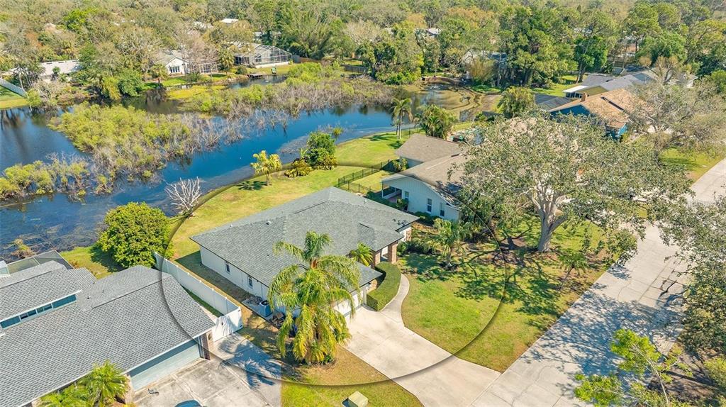 An aerial view of a single-story house with a palm tree and a large yard — 3033 GRAFTON STREET, SARASOTA, FL