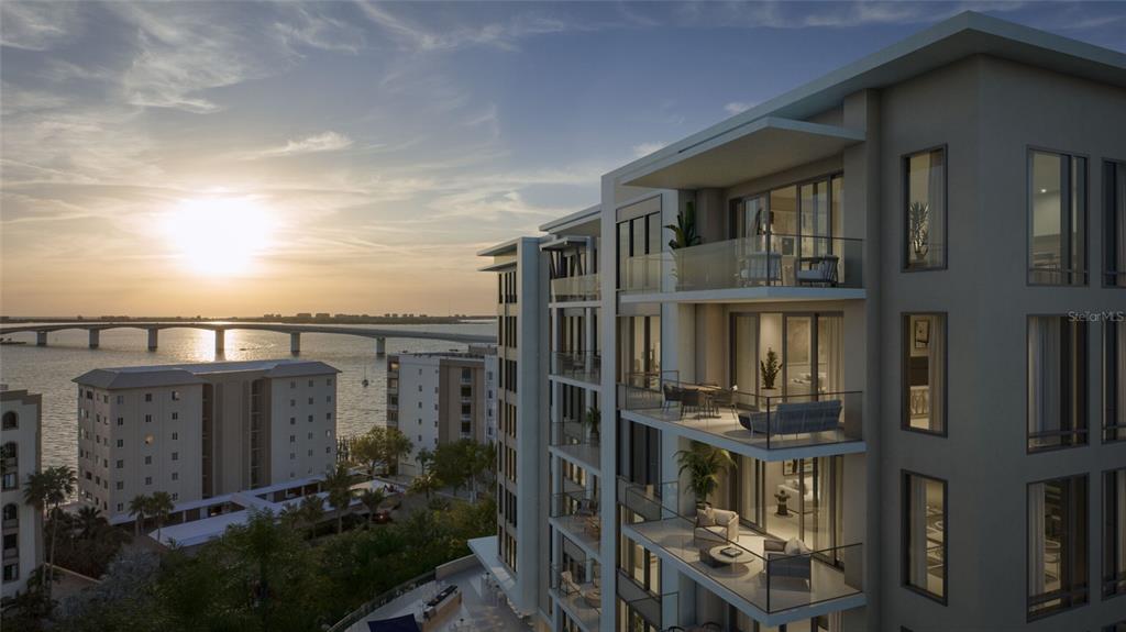 This architectural rendering shows a modern multi-story apartment building overlooking a bay and bridge — 325 GOLDEN GATE POINT UNIT 604, SARASOTA, FL