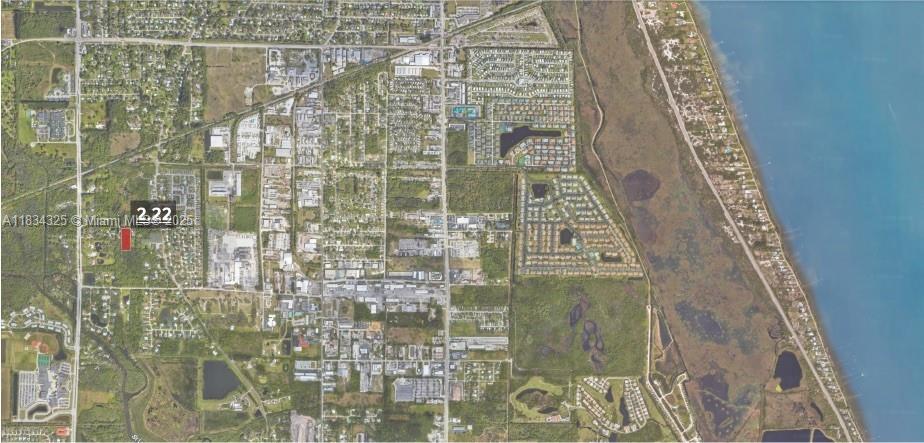 This is an aerial map showing a small red-highlighted parcel of land amidst suburban development — 2101 Dade Rd, Fort Pierce FL 34982, FORT PIERCE, FL