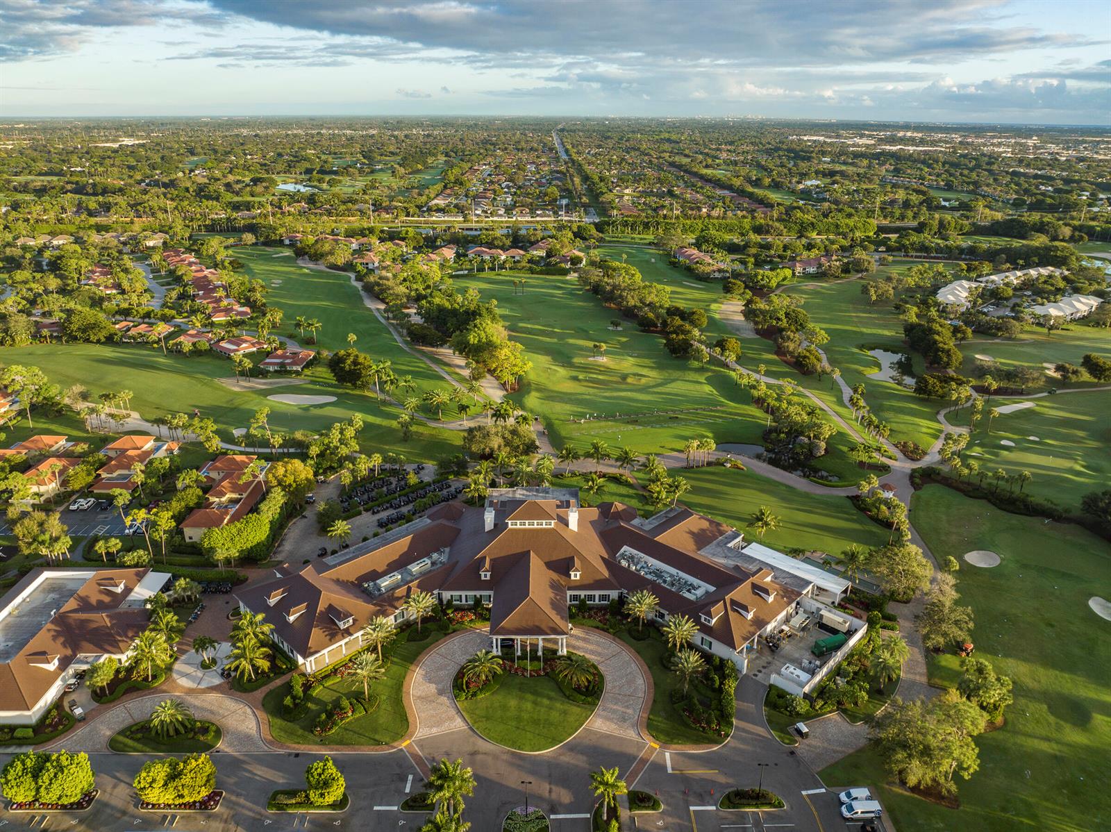 An aerial view of a large clubhouse with a circular driveway surrounded by a golf course — 3660 N Quail Ridge Dr Drive, Boynton Beach FL 33436, BOYNTON BEACH, FL