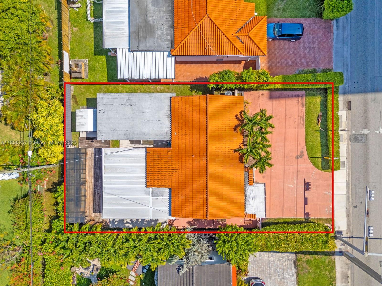 An aerial view shows a house with an orange tile roof and a large driveway — 1901 SW 37th Ave, Miami FL 33145, MIAMI, FL