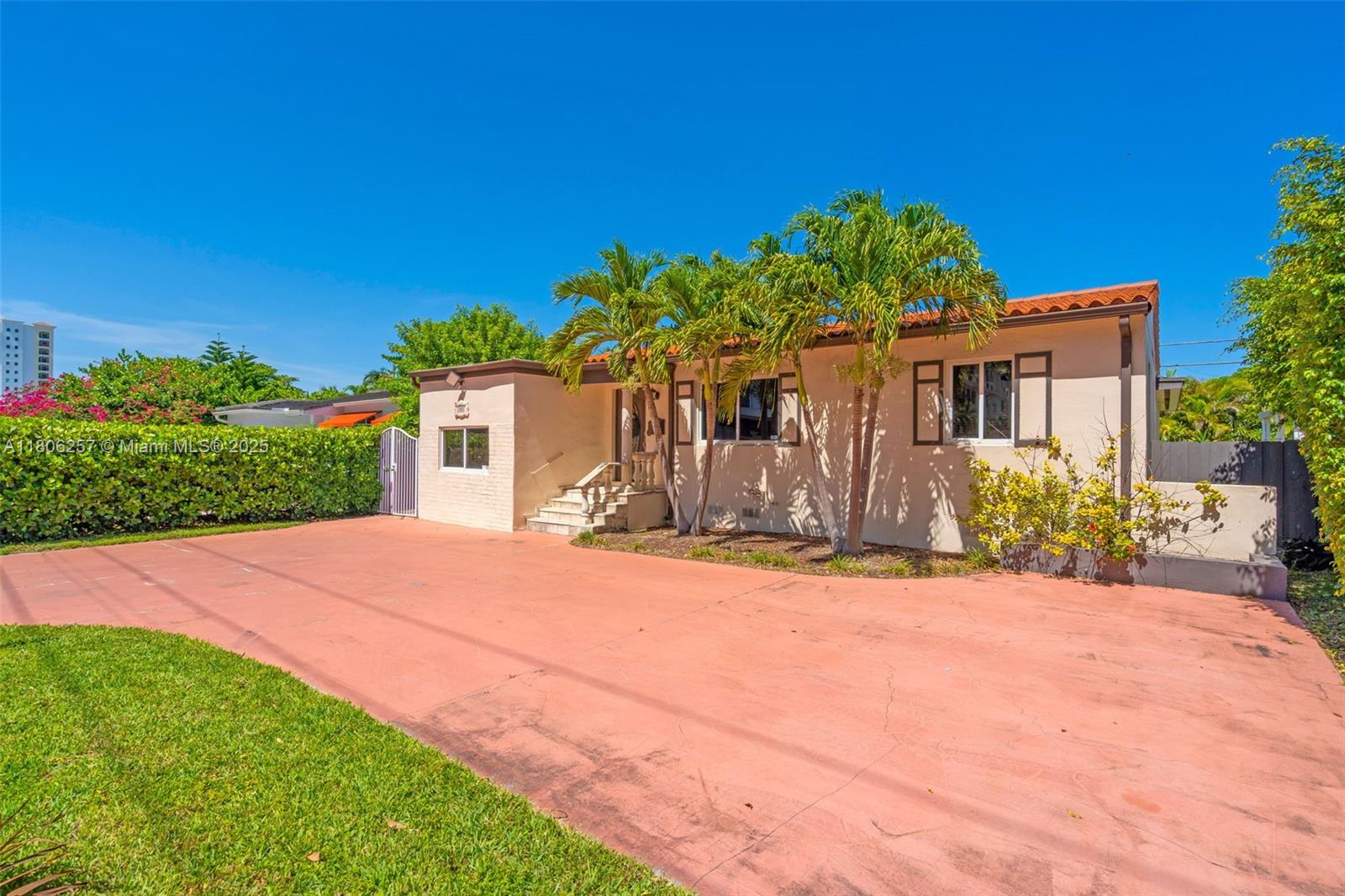 A single-story house with a red-tiled roof and a large paved driveway — 1901 SW 37th Ave, Miami FL 33145, MIAMI, FL