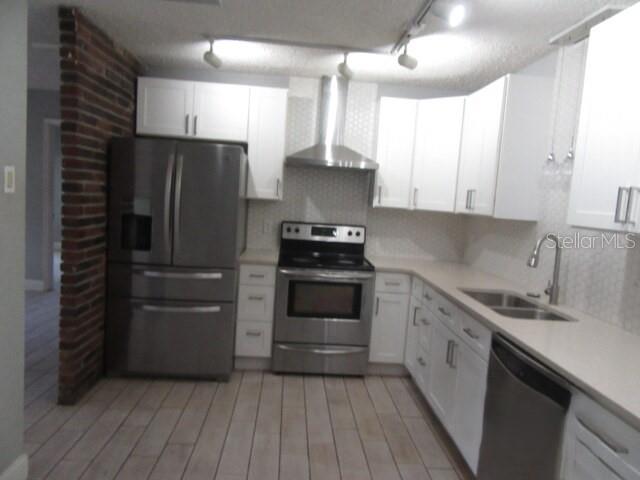 An aerial view shows a residential neighborhood with numerous mobile homes and scattered trees — 381 69TH STREET N, CLEARWATER, FL