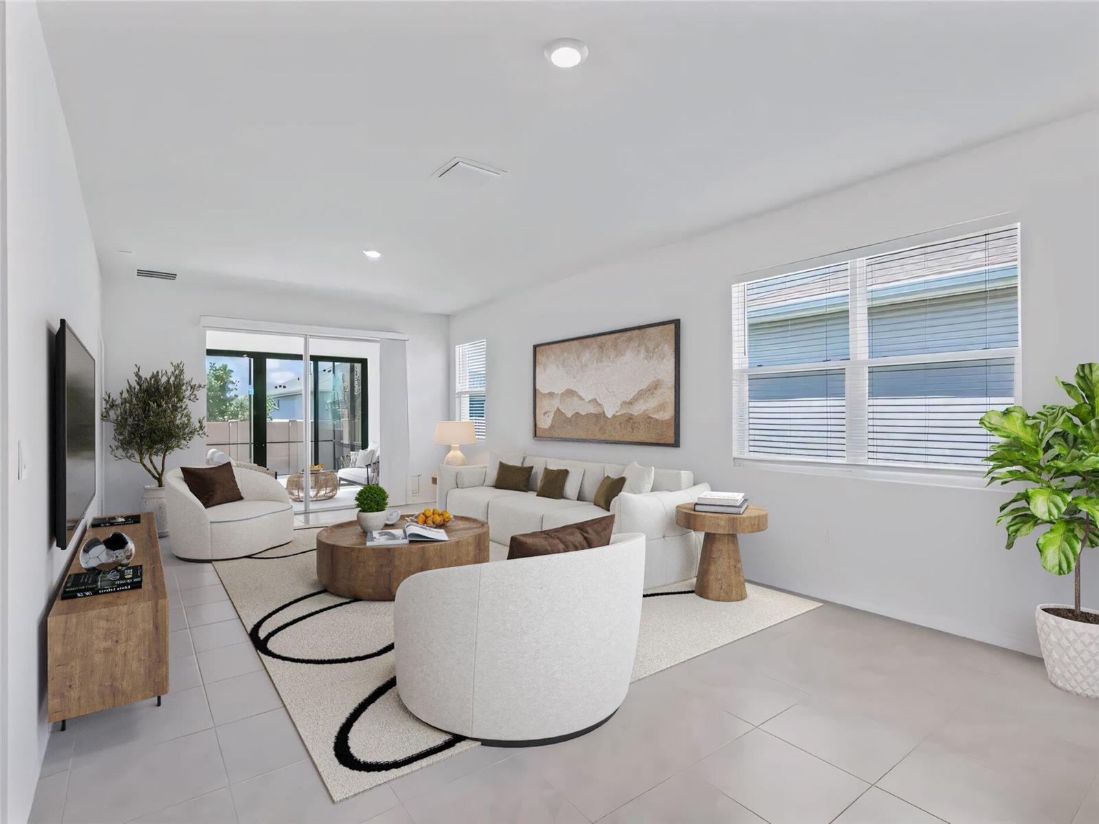 A bright living room features a white sofa, two armchairs, a wooden coffee table, and tile flooring — 5536 NW 40th Loop, Ocala FL 34482, OCALA, FL