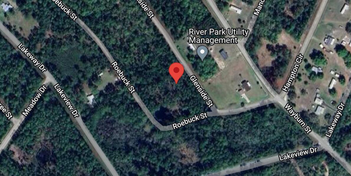 This is a satellite map view showing a red location pin on a wooded lot — 105 Glenside Street, FL 32139, FL