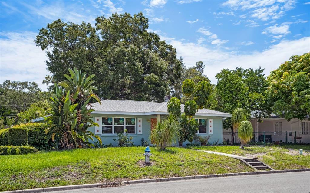 A light green single-story house with a front lawn and a fire hydrant — 617 26TH STREET W, BRADENTON, FL
