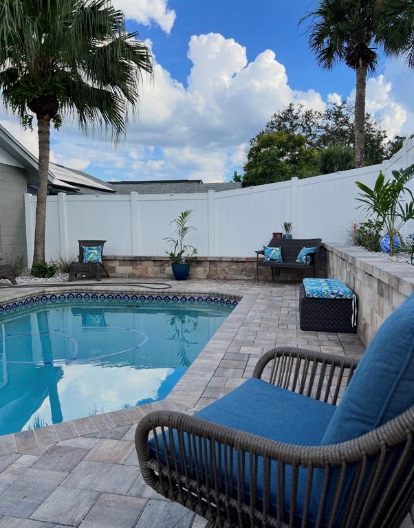 A single-story house with a gray exterior, red shutters, and a paved driveway — 2680 SHADYBRANCH DRIVE, ORLANDO, FL