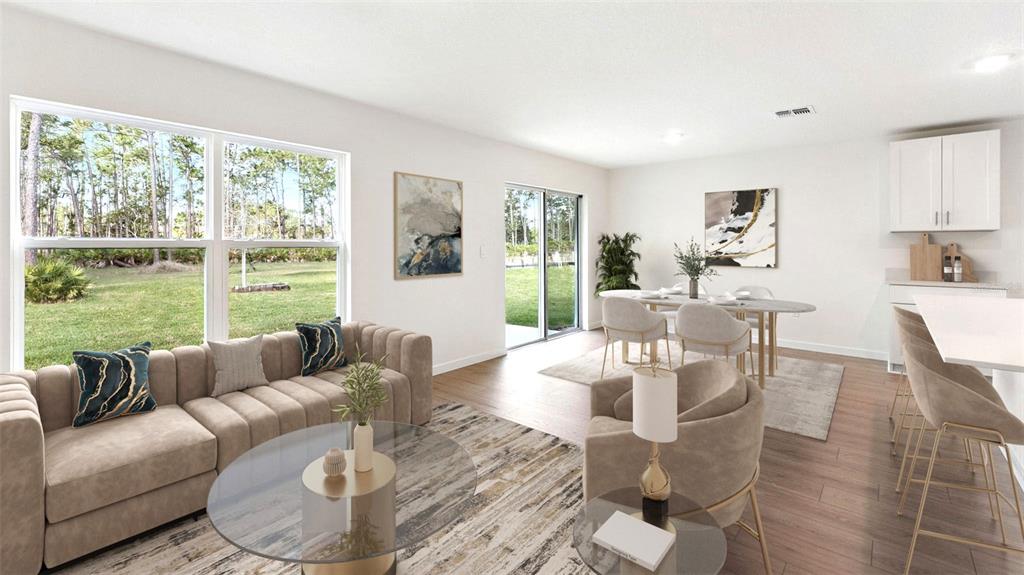 This rendering shows an open-concept living and dining area with light wood-look flooring — 1476 MORNING WALK DRIVE, ORMOND BEACH, FL