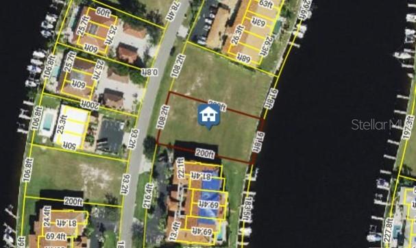 This aerial map shows a vacant rectangular waterfront lot outlined in brown — 3242 PURPLE MARTIN DRIVE, PUNTA GORDA, FL