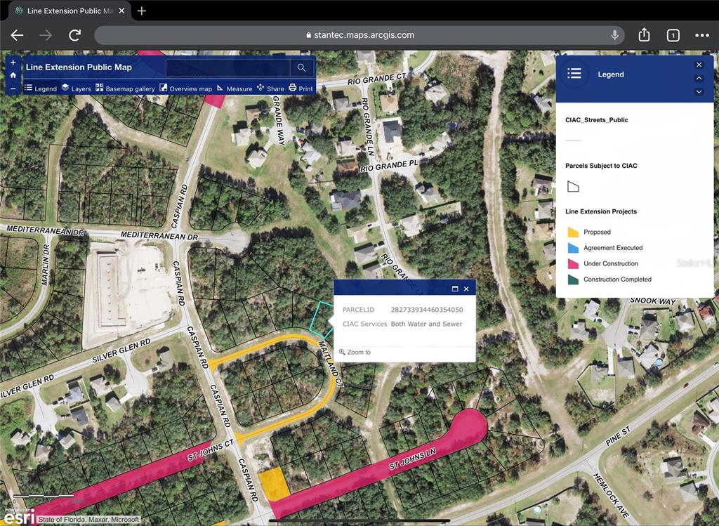 This is a digital map showing line extension projects and parcel information in a residential area — 411 MAITLAND COURT, POINCIANA, FL