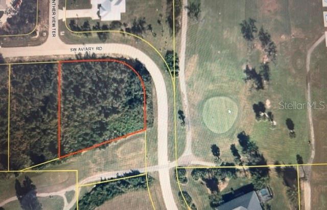 This is an aerial map showing a wooded residential lot adjacent to a golf course — 8395 SW AVIARY ROAD, ARCADIA, FL