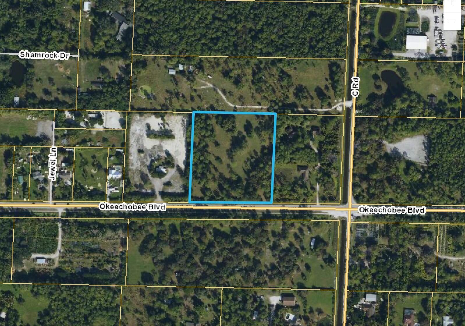 This is an aerial map view of a rectangular plot of land highlighted in blue — 15151 Okeechobee Boulevard, FL 33470, FL