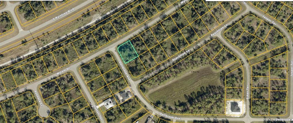 This is an aerial map showing a vacant residential lot highlighted in green — Lot 1 WYLAM DRIVE, NORTH PORT, FL